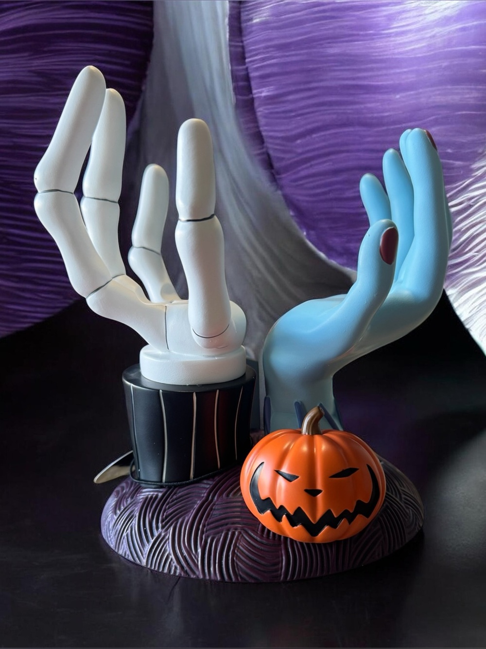 Disney Halloween Hand Display with White and Blue Hands and Orange Pumpkin